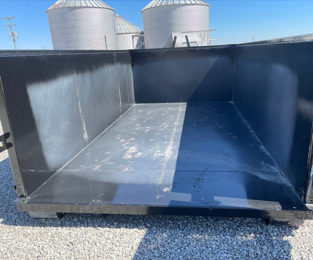 Interior view of a Next Can 15-yard black dumpster, showing its spacious and clean condition, suitable for dumpster rental in Marion, Ohio.