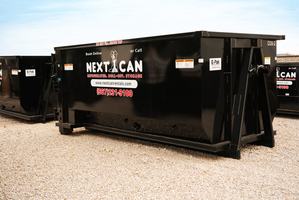 Side view of a black Next Can dumpster featuring the company's logo and contact information, promoting dumpster rental services in Marion, Ohio.